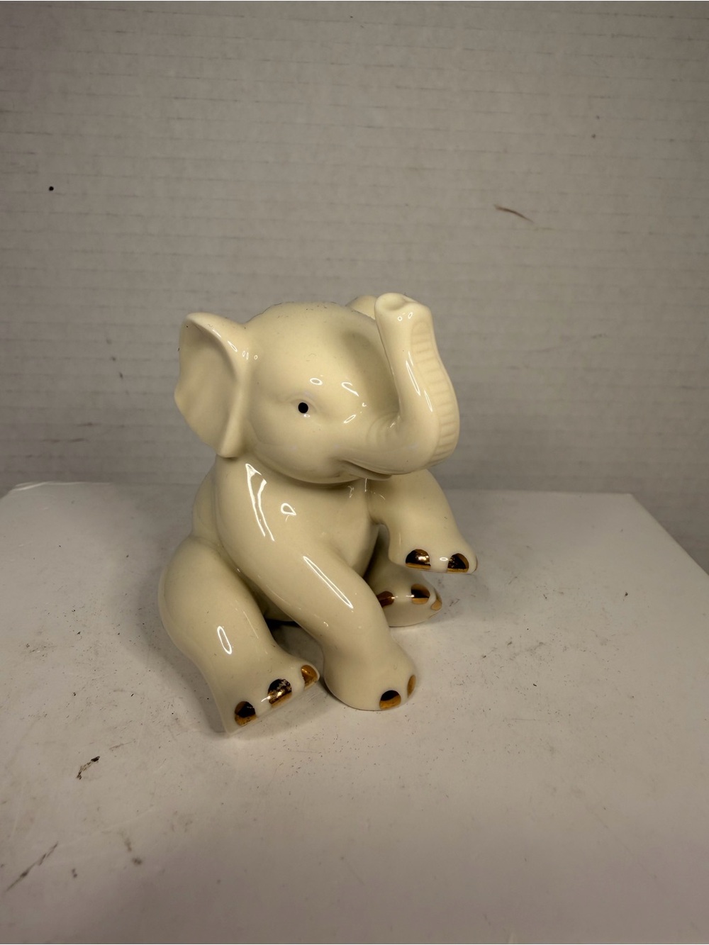 Lenox Sitting Baby Elephant
Fine China Figurine with Gold Trim
